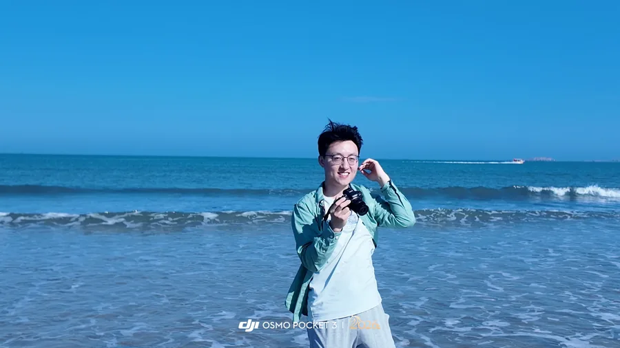 Standing on a beach beside the blue sea in Pingtan.