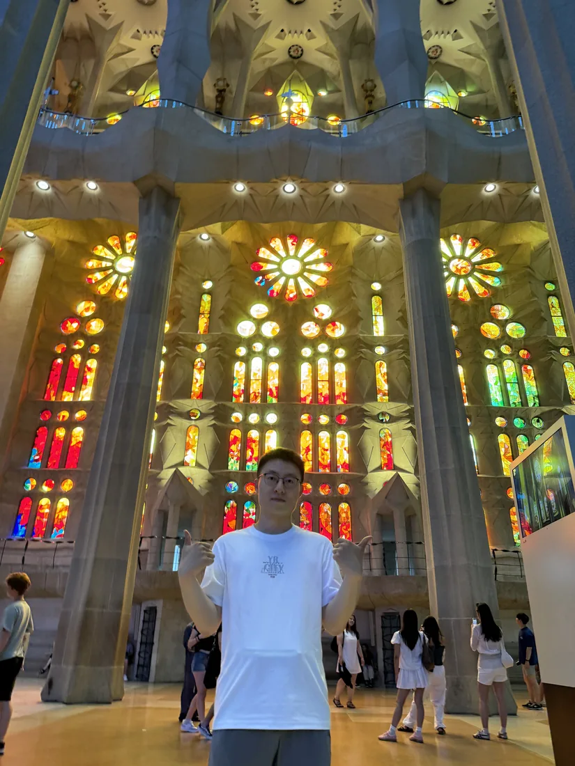 A portrait beneath the stained-glass windows of the Sagrada Família.