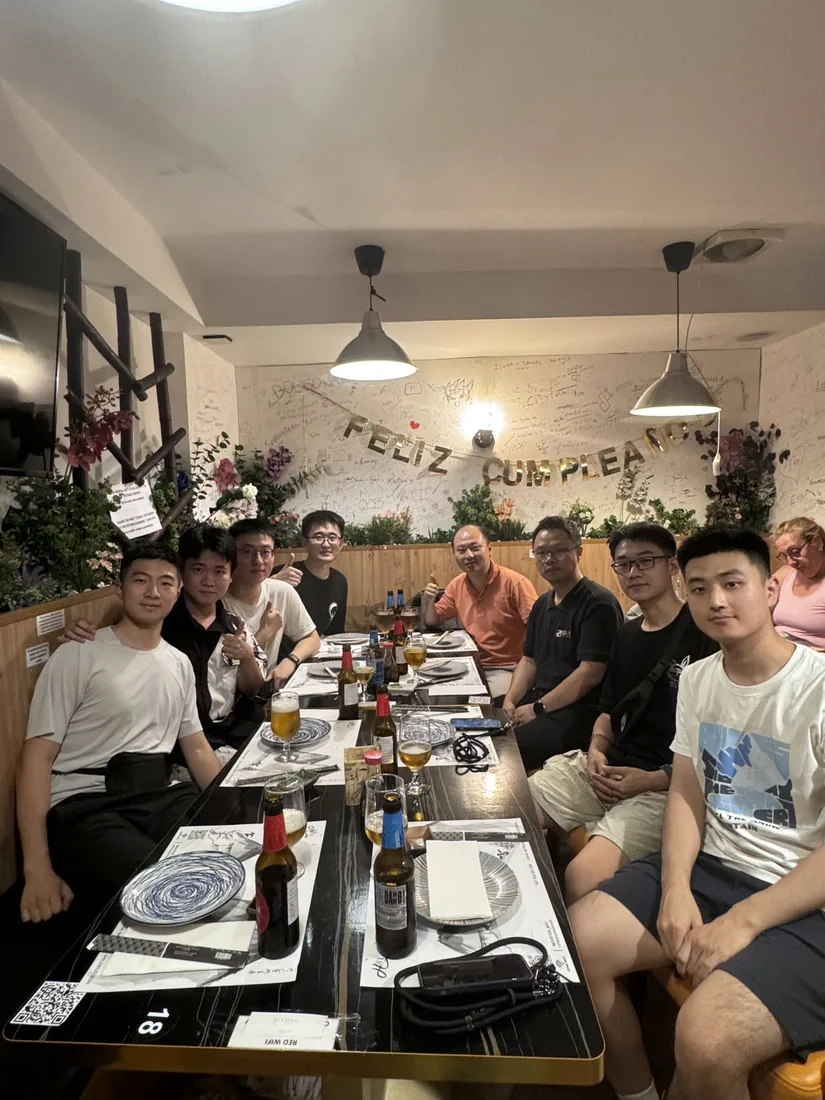 A group gathered around a restaurant table in Spain.